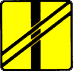 T-7 tabliczka wskazująca układ torów i drogi na przejeździe